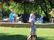Children playing in park at ribbon cutting