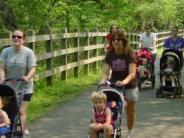 Moms walking with strollers on greenway