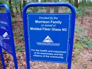Timberform sign - "Donated by the Morrison Family on behalf of Molded Fiber Glass NC for the health + enjoyment of the community