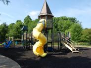 Other angle of yellow tube slide and play structure