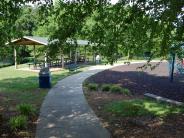 Path next to picnic shelter and play structure