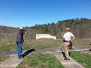 Two people shooting at range