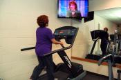 Woman on treadmill in exercise room