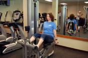 Woman using the leg press in the exercise room